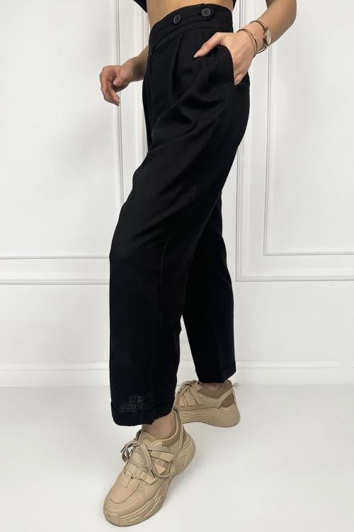 Women's trousers with asymmetric buttons